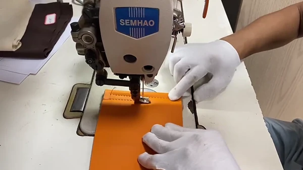 needle hole testing for sewing leather material