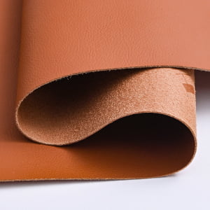 Brown microfiber leather material, rolled up