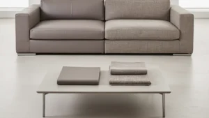 Sofa divided between leather-like upholstery and woven fabric with matching material swatches