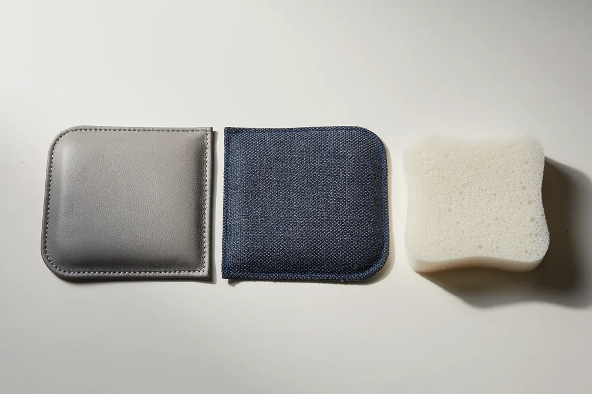 Concept upholstery sample panels beside a separate foam pad for prototype planning