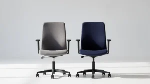 Two concept office chairs with matching shapes and contrasting coated and woven upholstery