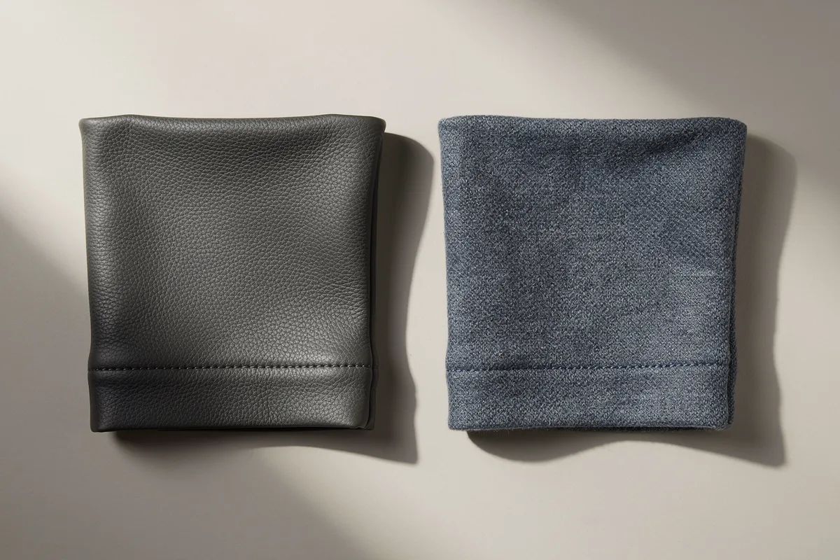 Dark leather-look cuff sample beside a blue textile cuff sample with stitched hems